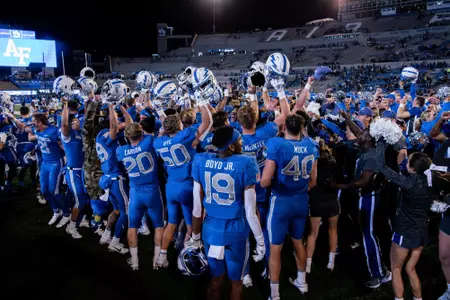 Helmets and hands, celebrations, Utah State