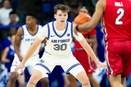 U.S. AIR FORCE ACADEMY, Colo. -- Air Force’s Eli Robinson defends during a game against Southern Illinois University Edwardsville on Nov. 21, 2025 at Clune Arena in Colorado Springs, Colo. Air Force earned their second win of the season over SIUE with a final score of 77-63. (U.S Air Force Photo by Ray Bahner)