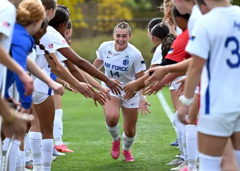Kambree Duker runs through the starting lineup line