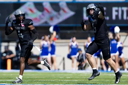 Mikhail Seiken jogs off field vs. Navy