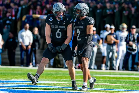 Blake Fletcher and Korey Johnson celebrate vs. Navy