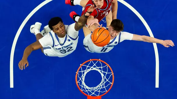 U.S. AIR FORCE ACADEMY, Colo. -- Air Force’s Brendan Martin and Kolby Gilles attempt to block Fresno State's Gasper Kocevar shot during the game on Jan. 31, 2026 at Clune Arena in Colorado Springs, Colo. Air Force fell to Fresno State 62-79, the Falcons rebounded the most in a conference game this season with 36 total grabs. (U.S Air Force Photo by Ray Bahner)