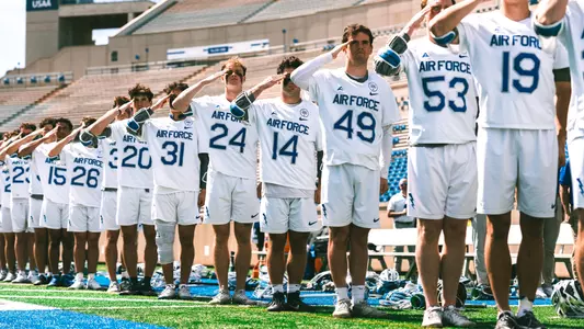 AF Lacrosse salutes during the National Anthem