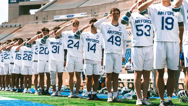 AF Lacrosse salutes during the National Anthem