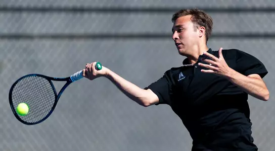 Langdon Tingleaf returns a shot against North Dakota