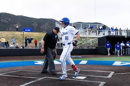 Ben Niednagel smiles as he touches home plate after hitting a home run to complete the cycle against San Jose State at Erdle Field.