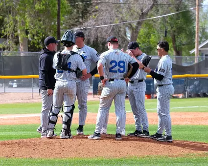 Air Force baseball infielders have conversation on the mound