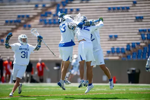 Players celebrate a goal against Mercer
