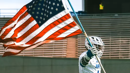Player runs out with American Flag