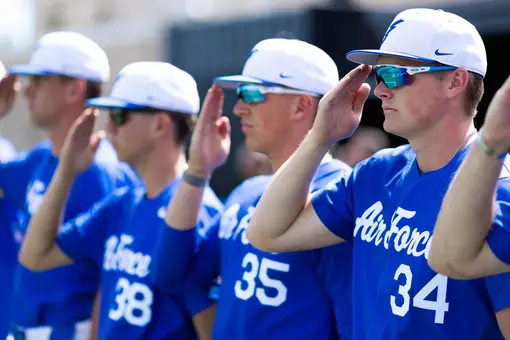 Garrett Hutchins salutes during the national anthem at Erdle Field