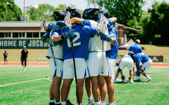 The team huddles in pregame warmup