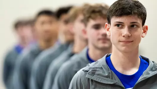 Ryan Jacobsen led the Falcons out during team introductions at the 2026 USAG Collegiate Nationals.