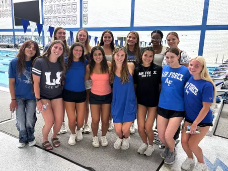 The Air Force women's swimming and diving class of 2030 poses before I-Day