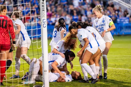 Teammates celebrate with Jordan Dillingham after she scored on a header against Army