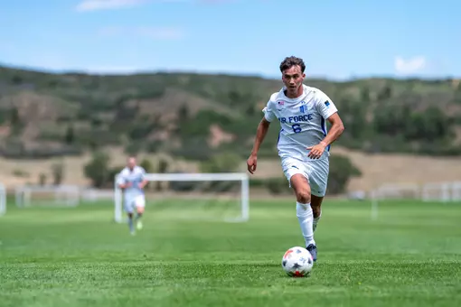 Oliver Becker dribbles the ball down the pitch at USAFA