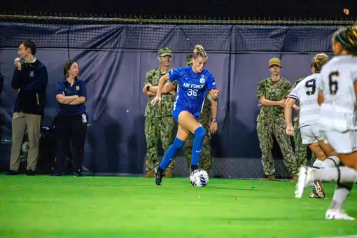 Kendall Rippley drives the ball towards the attacking third at Navy