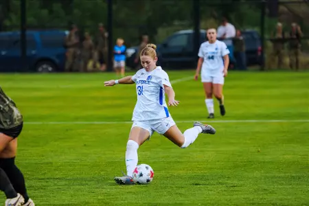 Ellie McCarron prepares to strike the ball against Army