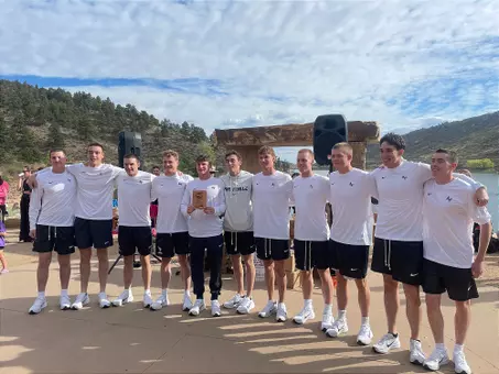 Men's swim team accepting their first place award at the Horsetooth Open