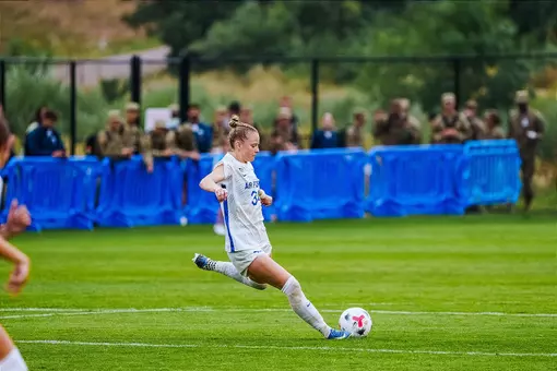 Lauren Steinlage winds up to strike the soccer ball.