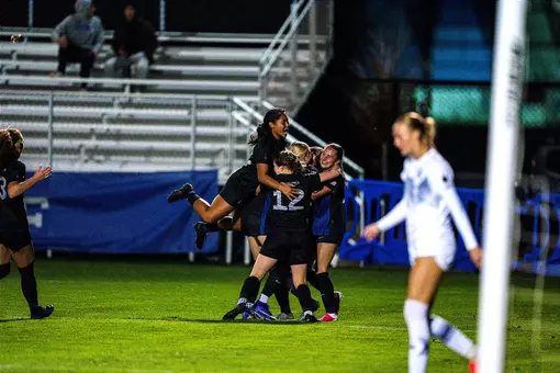 The women's soccer team celebrates a goal by Clara Teigland against UC Davis