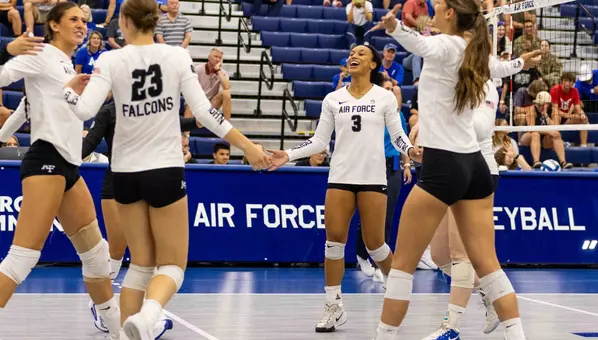 The Falcons celebrate a point during their exhibition against Mines.