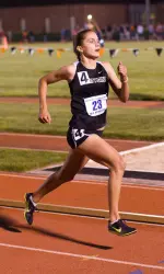 Lisa Junta winning the 10,000-meter run title on Friday night