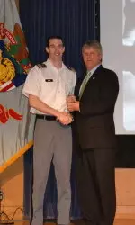 Cheyne Rocha accepts the Community Service Award.