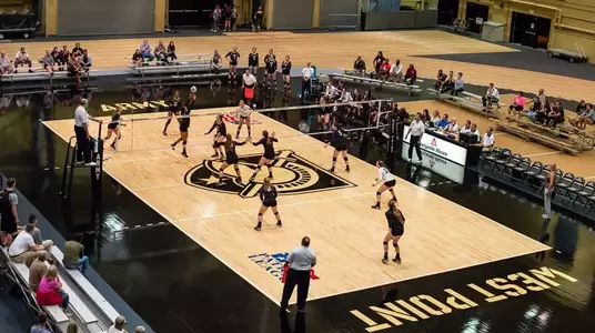 Gillis Field House during an Army Volleyball match with players on the court.