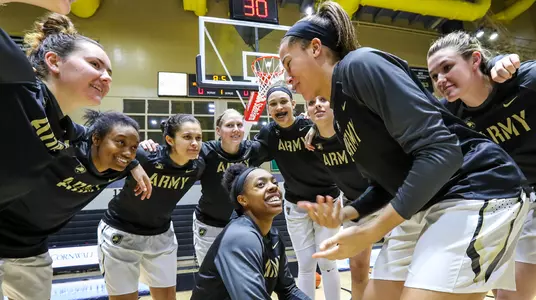 women's basketball team huddle