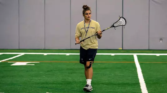 Assistant coach Carly O'Connell watches over practice