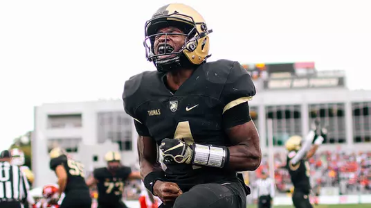 QB Cam Thomas shows emotion after the Black Knights score a touchdown against Miami (OH)