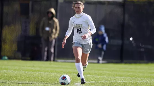 Sydney Witham dribbling vs. Holy Cross