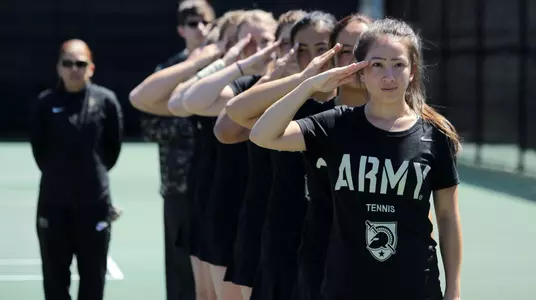 Women's Tennis team saluting prior to 2018 PL Championship match vs. Navy