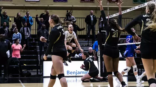 Volleyball celebrates defeating American