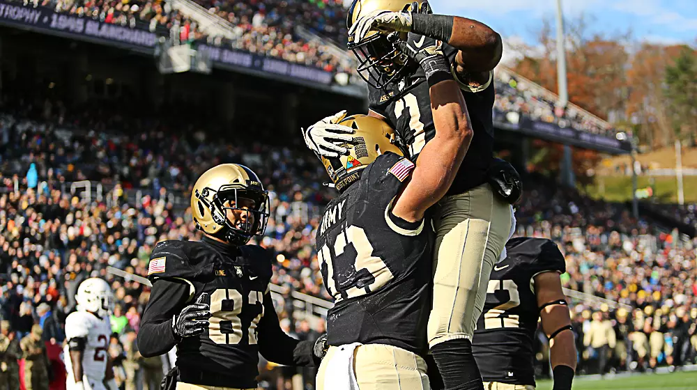 Darnell Woolfolk celebrates with teammates after scoring a touchdown against Lafayette
