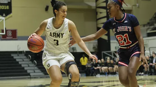 Jess Lewis dribbling down the court against St. John's on Nov. 16 in the home opener for the Black Knights.
