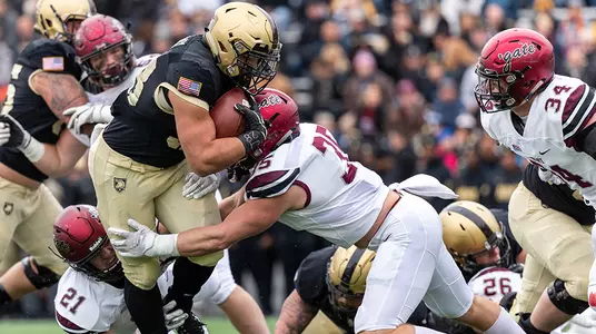 WEST POINT, NY - NOVEMBER 17: Darnell Woolfolk #33 of the Army Black Knights is tackled by Nick Ioanilli #35 of the Colgate Raiders at Michie Stadium on November 17, 2018 in West Point, New York. (Photo by Dustin Satloff/Getty Images) *** Local Caption *** Nick Ioanilli;Darnell Woolfolk