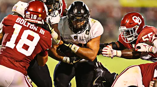 Darnell Woolfolk rushes the ball for Army against No. 5 Oklahoma