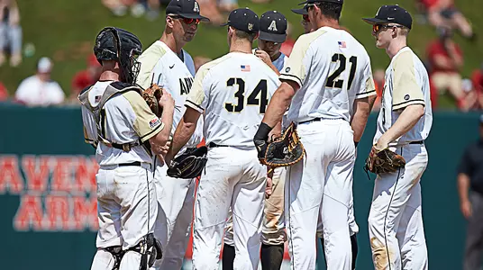 Head coach Jim Foster speaks with the team during its contest with N.C. State in the 2018 NCAA Raleigh Regional