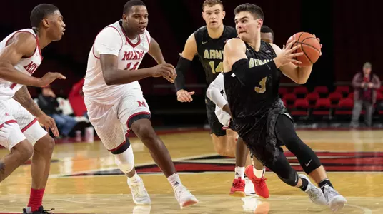Tommy Funk drives the lane against Miami (OH)