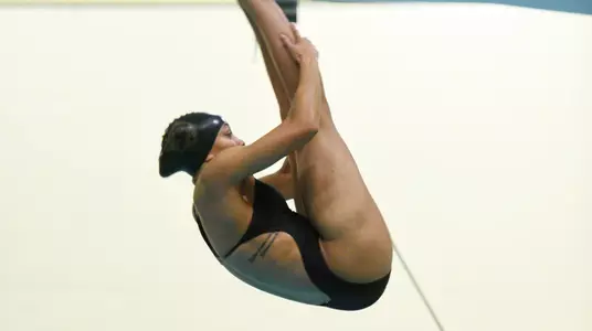 Serica Hallstead dives into the water