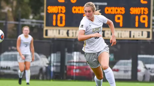 Erynn Johns chasing a ball vs. Binghamton