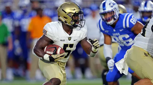 Aug 31, 2018; Durham, NC, USA; Army Black Knights running back Kell Walker (5) rushes the ball against the Duke Blue Devils during the first half at Wallace Wade Stadium. Mandatory Credit: Danny Wild-USA TODAY Sports