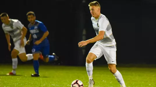 Keenan O'Shea dribbles the ball up the field