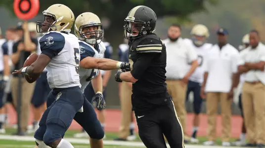 James Scroggins chasing Navy quarterback