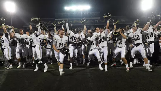 Sprint football team celebrating 2018 win at Navy
