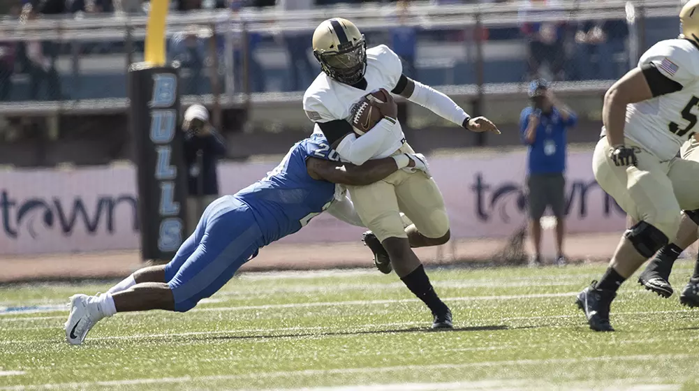 Quarterback Kelvin Hopkins runs through a tackle in Army's 42-13 win over Buffalo on Sept. 29, 2018.