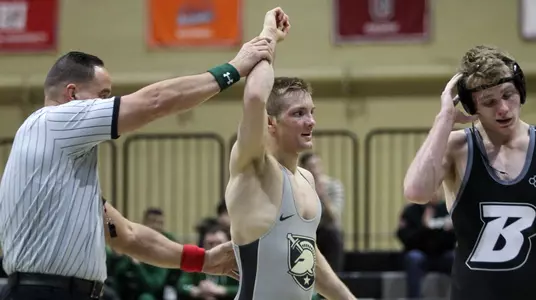 Lane Peters getting his hand raised after pinning Binghamton