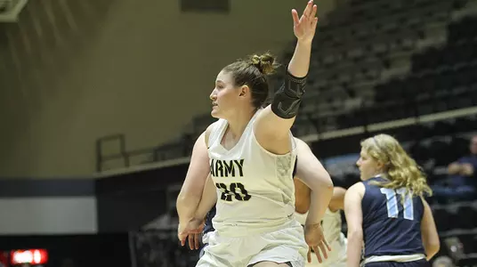 Sarah Furch posts up against Connecticut College on Dec. 30, 2018