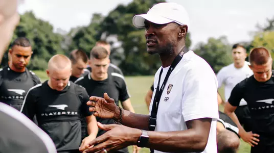 Russell Payne addresses the team during the preseason